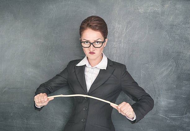 istock Angry teacher with wooden stick 176977504