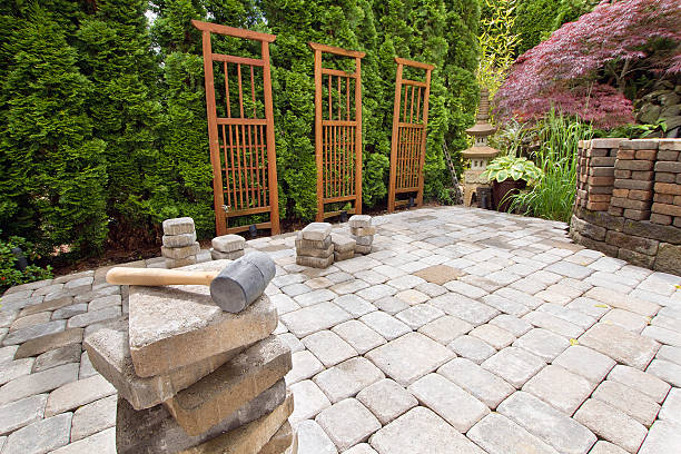 Stack of Brick Pavers for Hardscape Stack of Brick Pavers for Hardscape in Backyard Landscaping with Trellis and Trees hardscape photos stock pictures, royalty-free photos & images