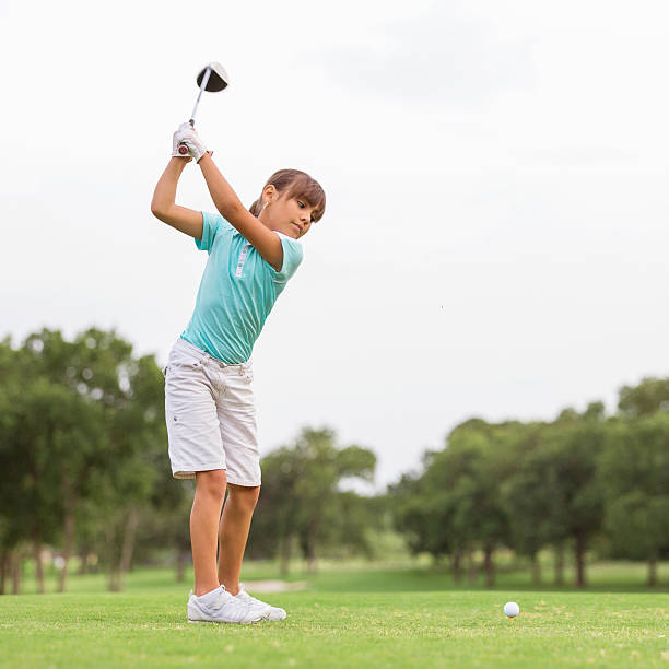 istock Young golfer teeing off on beautiful golf course 176978710