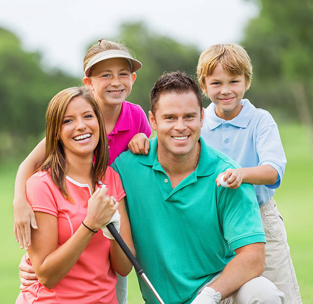 istock Happy family playing golf together on green course 176978754