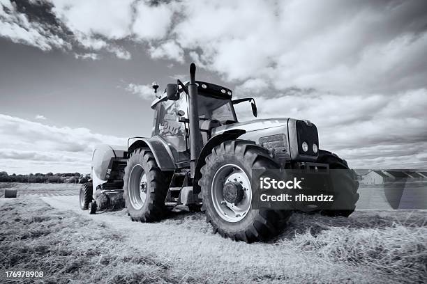 Tractor Collecting Haystack In The Field Panning Technique Stock Photo - Download Image Now
