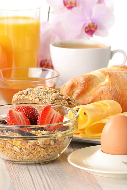 istock Breakfast with coffee, rolls, egg, orange juice, muesli and chee 176979477