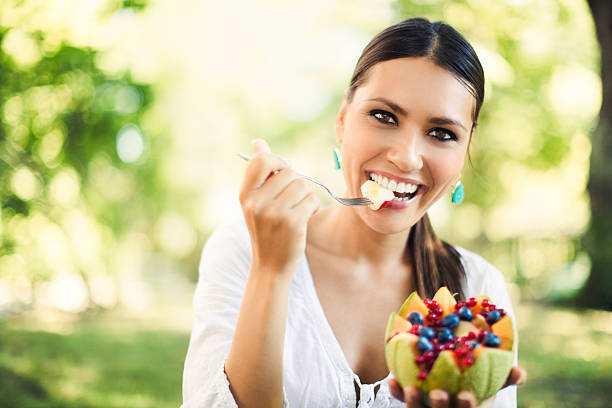 istock Pretty beauty eating fruit salad 176979797