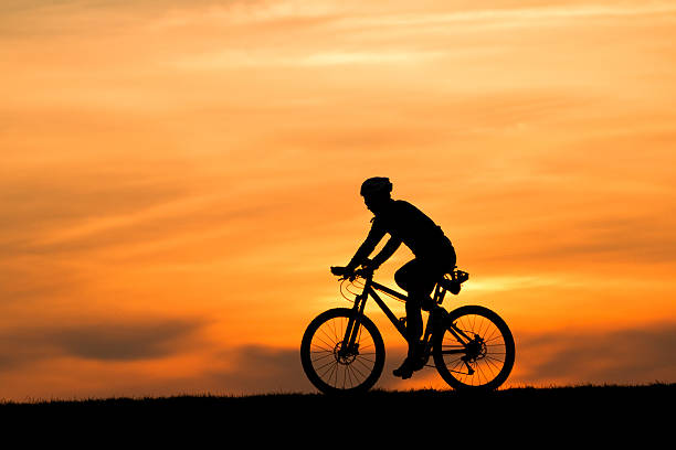 istock silhouette of y caclist 176980293