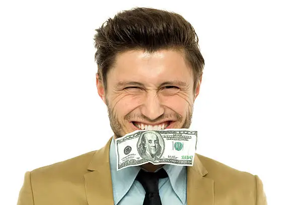 Man with a dollar-bill in his mouth