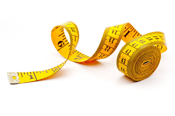 Yellow measuring tape on white background