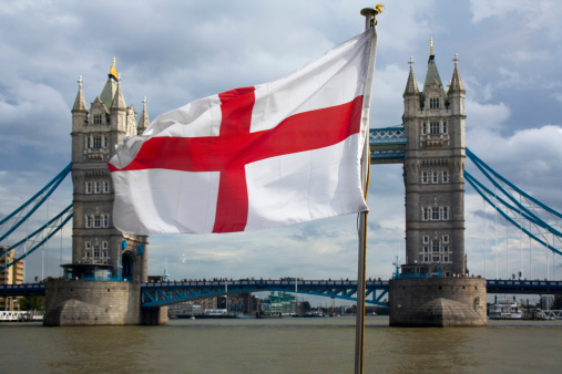 Tower bridge and english flag in London