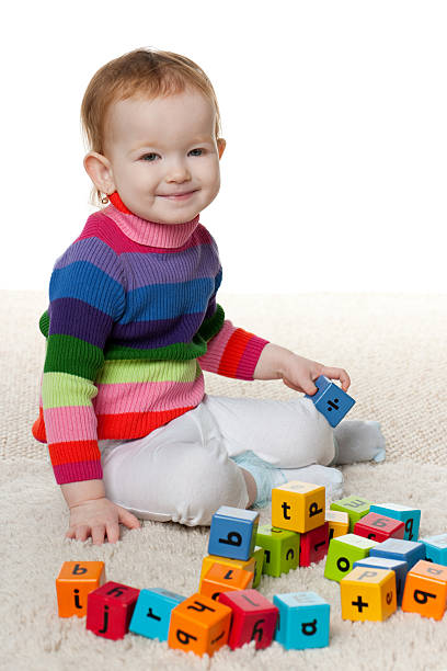 istock Redhead little girl with blocks 176980813