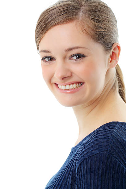 Beautiful casual young woman standing isolated against white background stock photo