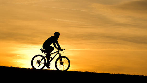istock silhouette of a biker 176981953