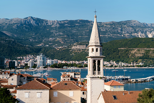 Bell tower of the citadel of St. Mary among the old houses. Budva, Montenegro. High quality photo