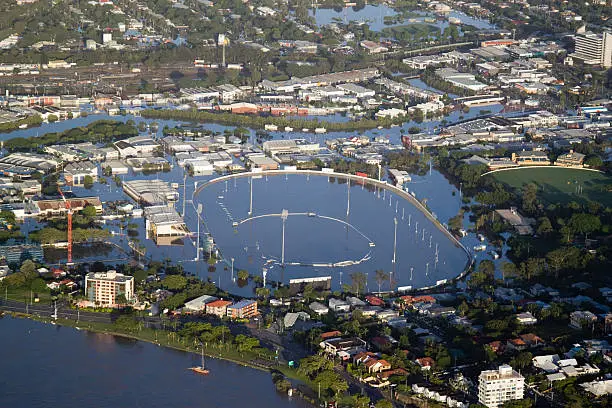 "Aerial view during the Brisbane Flood of 2011, the greatest flooding disaster in Australiaaas history. Image shows the Albion Park Raceway submerged, as well as the suburb of Breakfast Creek and the Brisbane River."