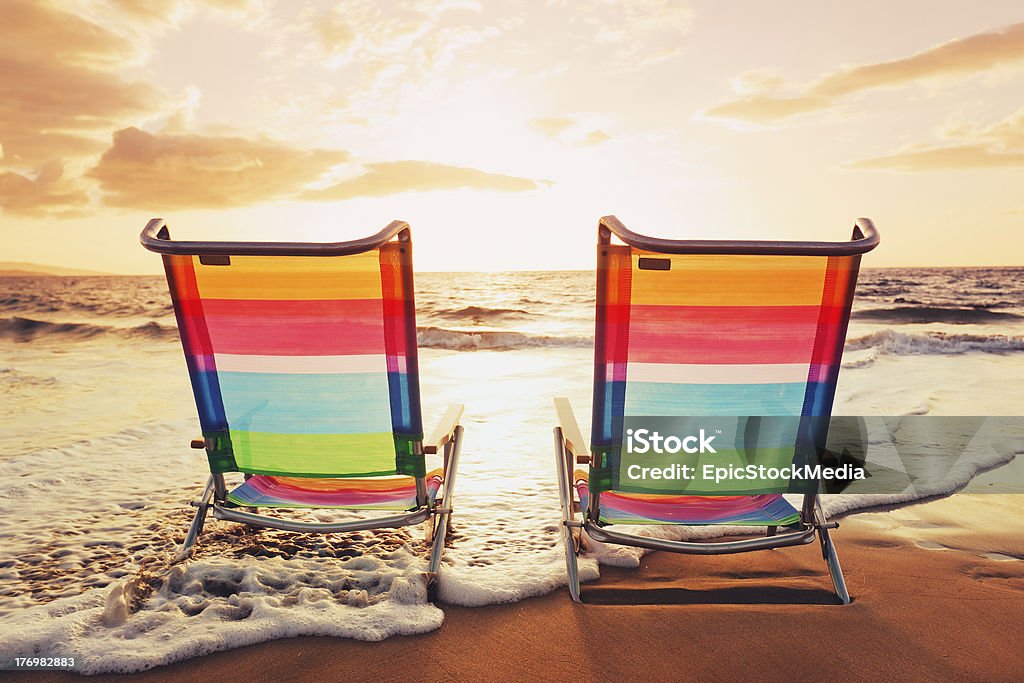Hawaiian Vacation Sunset Concept "Hawaiian Vacation Sunset Concept, Two Beach Chairs at Sunset" Beach Stock Photo