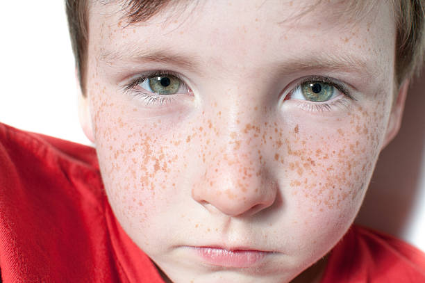 istock green eyes and freckle 176983576