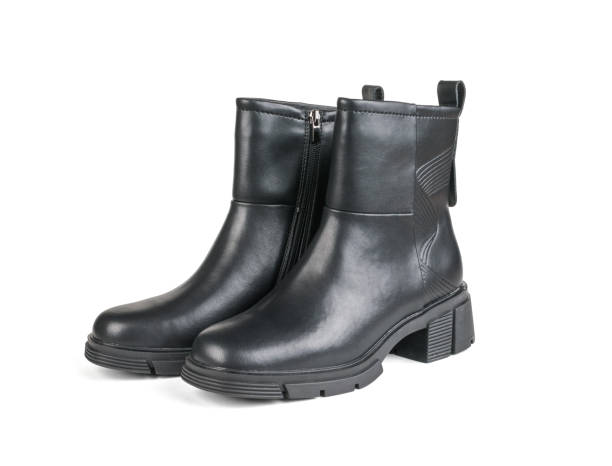 istock A pair of women's leather ankle boots with heels isolated on a white background. 1769840869