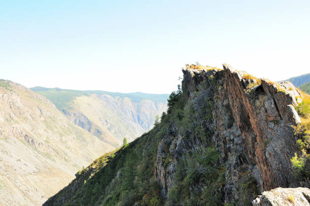 istock A ridge of high rock with layered rock formations overlooking a deep canyon. 1769841388