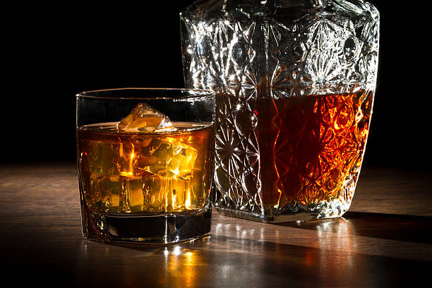 Carafer, glass with ice and whisky