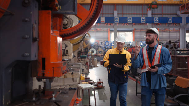 istock Engineer and technician discussing machinery in factory to plan inspection maintenance according to usage cycle, Concepts inspections based on usage cycle maintenance 1769846726