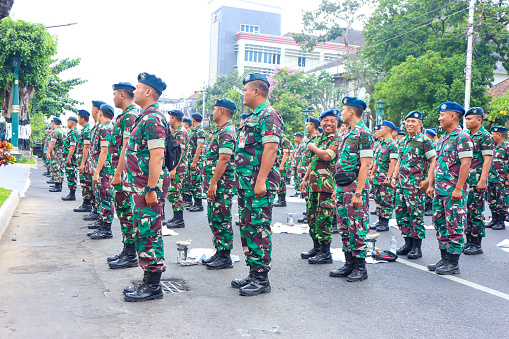 Yogyakarta, Indonesia, October 2, 2023 : Indonesian army standing in a row for morning assembly in the city road