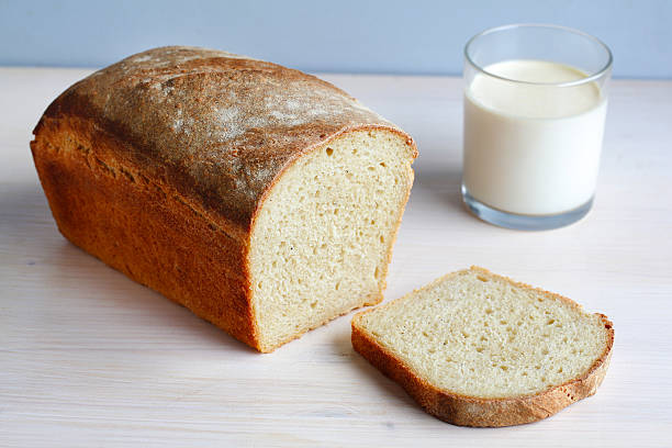 istock Sliced homemade cornbread with a glass of milk, breakfast 176984930