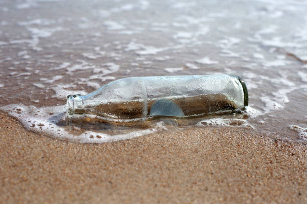 istock Glass bottle on the beach 1769858698