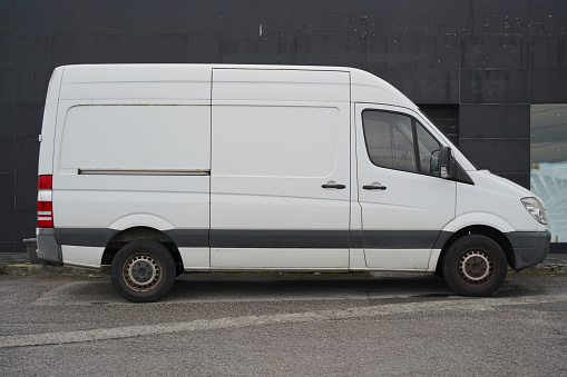 delivery van with blank space for advertisements. Furgo van parked