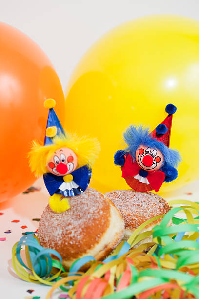 istock Krapfen or donuts with clowns and streamer 176986215