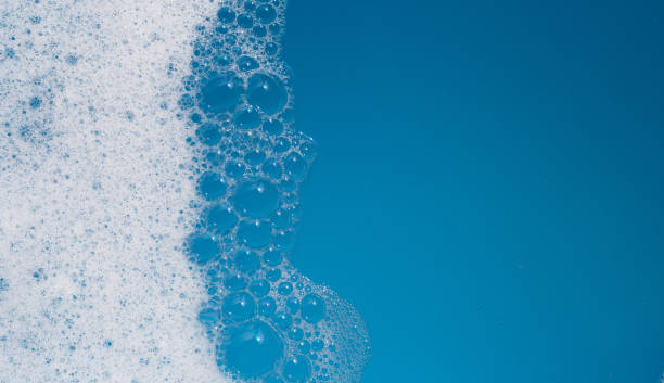 istock Detergent foam bubble on water. Blue background, Soap sud 1769862428