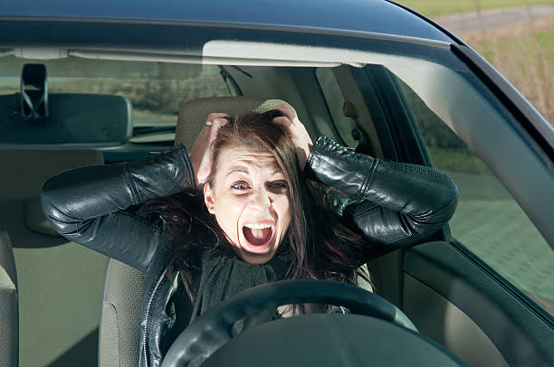 istock afraid young woman in the car 176986364