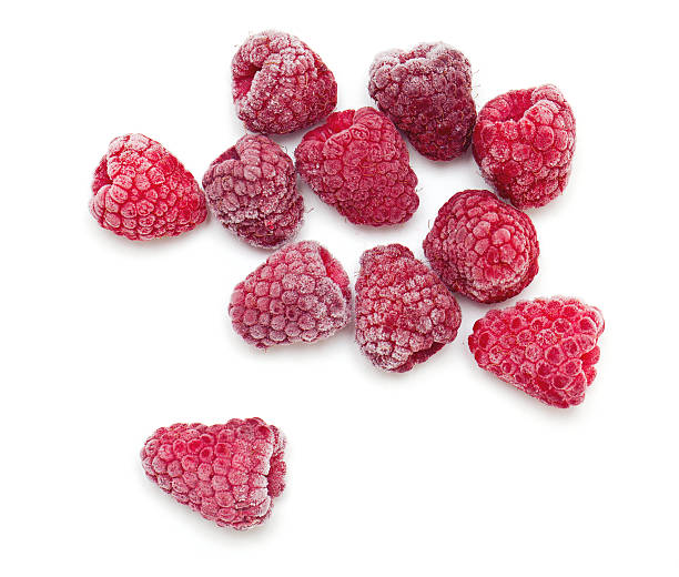 frozen raspberries frozen raspberries isolated on white frozen water stock pictures, royalty-free photos & images