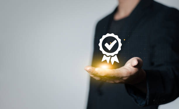 istock Standardization concept. Businessman show quality assurance symbol icon and performance, service, guarantee, standards, ISO certification. 1769871060