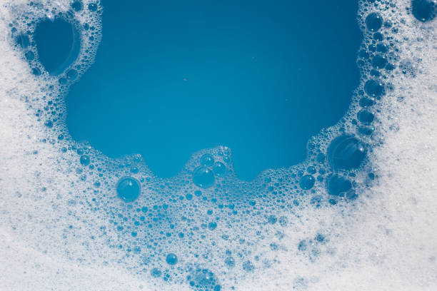 istock Detergent foam bubble on water. Blue background, Soap sud 1769872143