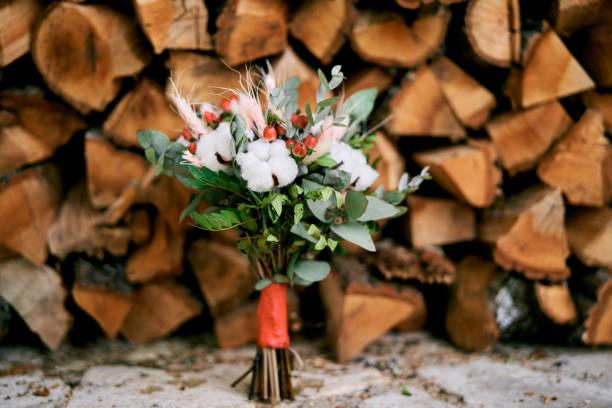 istock Wedding bouquet stands on a tile near a woodpile 1769873707