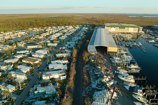 Boat station destroyed by hurricane wind in Florida coastal area. Consequences of natural disaster.