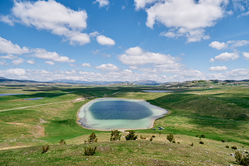Blue Enemy Lake on a green meadow in a mountain valley. Durmitor, Montenegro. High quality photo