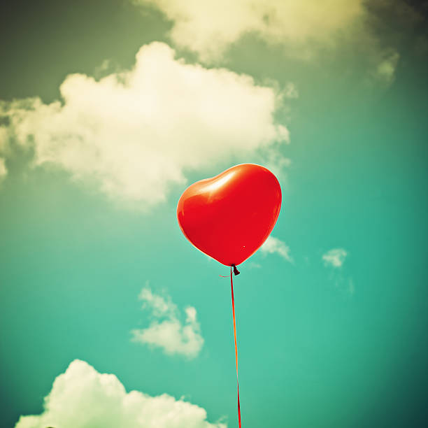 istock Heart balloon in sky 176988189