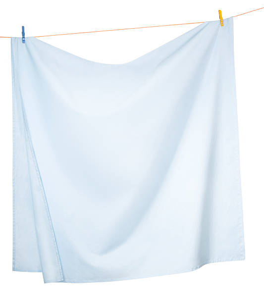 Drying Linen sheets "Linen sheets drying on a rope, isolated on a white background" hanging fabric stock pictures, royalty-free photos & images