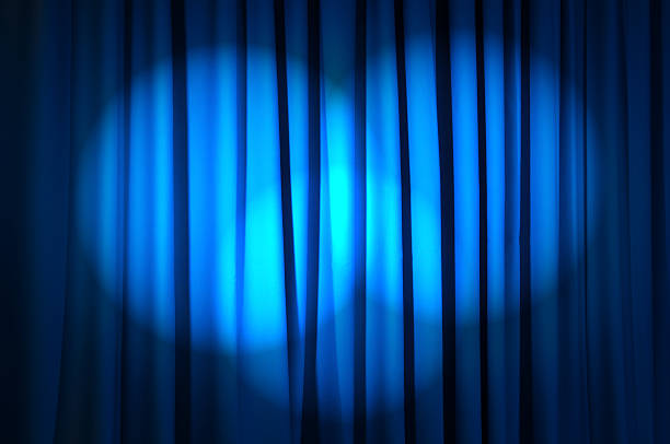 istock Beautiful blue curtain with spotlights shining on it 176988503