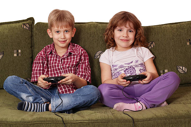 istock boy and little girl play video game 176988542