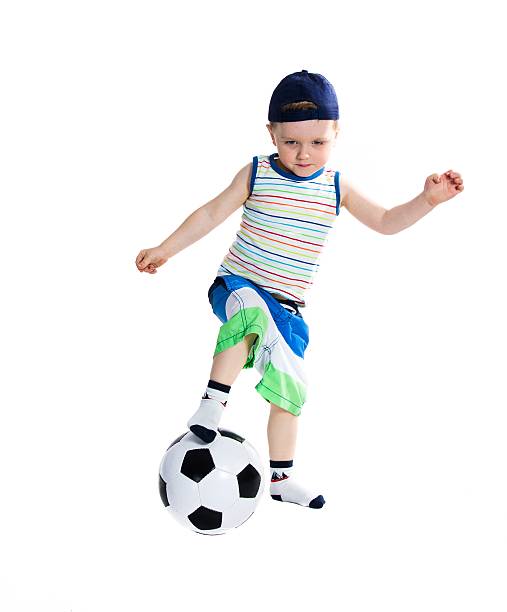 little-soccer player - soccer child indoors little boys stock-fotos und bilder