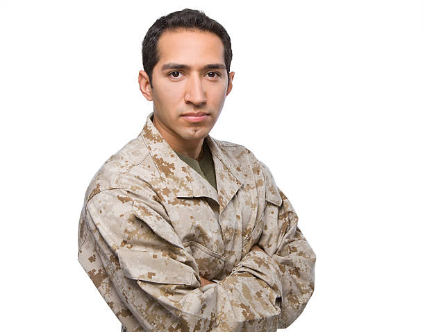 Full length, low key studio shoot of fully equipped army soldier in camo uniform and helmet, armed with pistol and assault service rifle with underbarrel grenade launcher isolated on white backgroundFull length, low key studio shoot of fully equipped army soldier in camo uniform and helmet, armed with pistol and assault service rifle with underbarrel grenade launcher isolated on white background