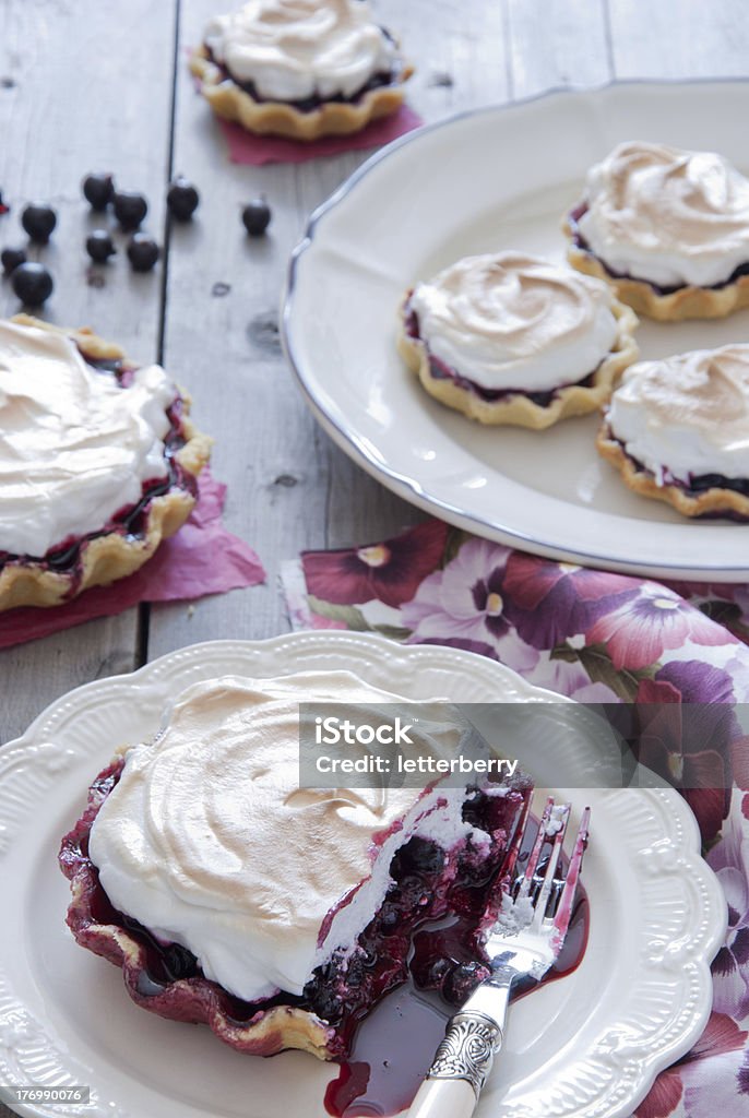 Tartlets with black currant and meringue Baking Stock Photo