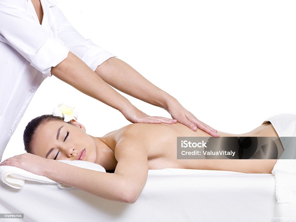 Spa relaxing massage for young beautiful woman Spa massage for beautiful pretty woman - isolated on white background - Beauty treatment therapy Adult Stock Photo