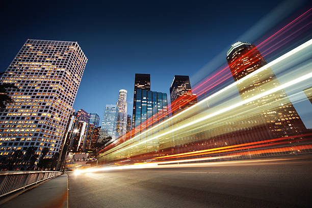 Los Angeles at night Los Angeles at night. Long exposure shot of blurred bus speeding through night street. light commercial vehicle stock pictures, royalty-free photos & images