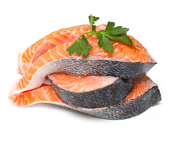 istock slices of fresh salmon with parsley on white 176991222