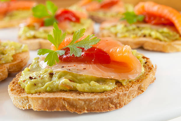 istock Crostini or Bruschetta with Guacamole, Smoked Salmon and Fire Ro 176991247