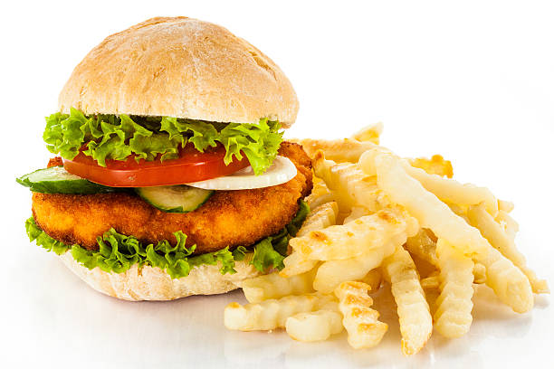 istock Big hamburger with French fries on white background 176991548