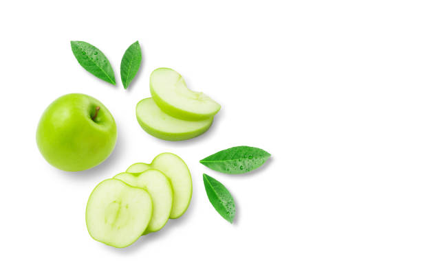 istock Green apple with sliced and green leaves isolated on white background. 1769915619