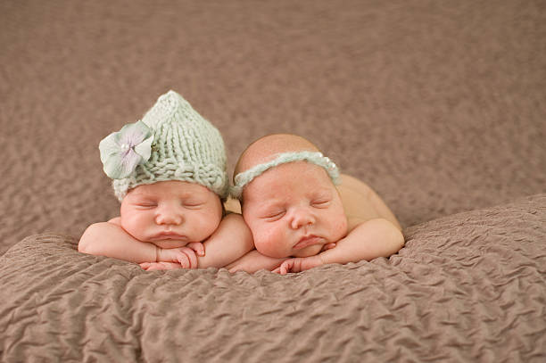 istock Sleeping Newborn Twin Girls 176991615