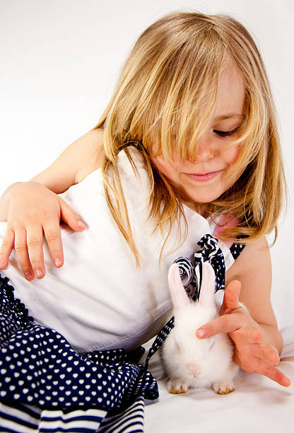 istock Little Girl and Rabbit 176992269